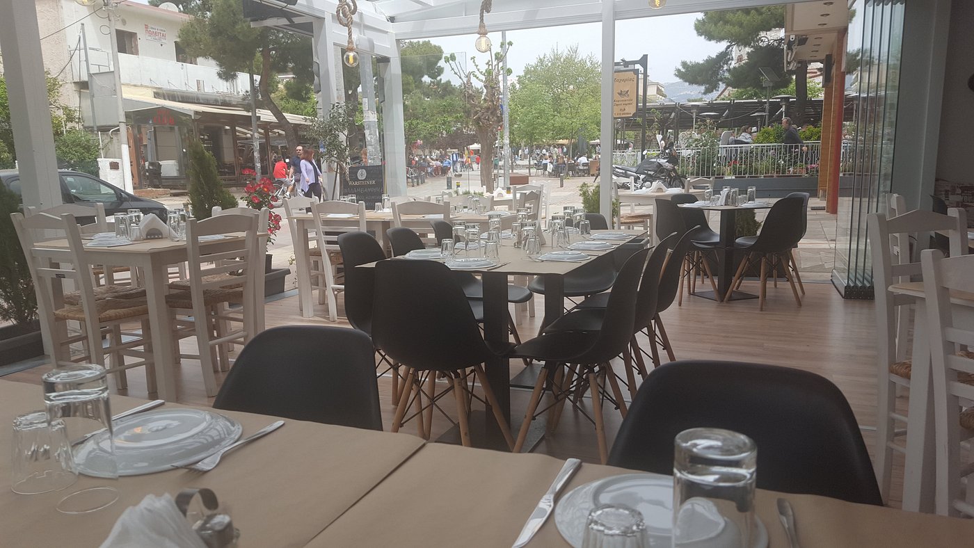 Restaurant seating overlooking the pedestrian square in Vrilissia
